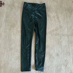 Dark green Vegan leather leggings.